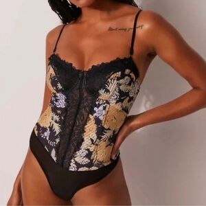 Good Luck Charm printed bodysuit by Intimately Free People in size Large